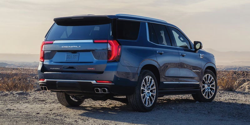 Blue 2026 GMC Yukon showcasing rear design near Hastings, Nebraska